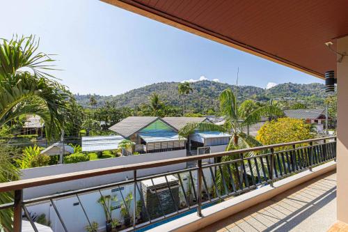 a view from the balcony of a resort at Happy Eight Resort in Nai Harn Beach
