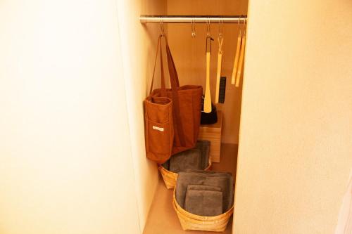 a room with a bunch of bags in a closet at modern villa, asterisk ONOMICHI 2 in Onomichi