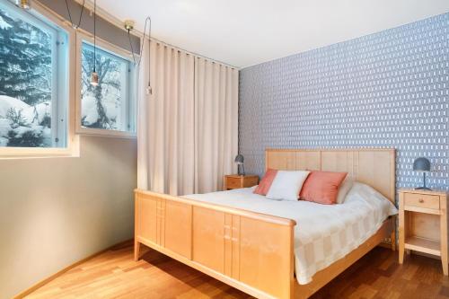 a bedroom with a bed and a window at Aurora Sky Villa in Rovaniemi