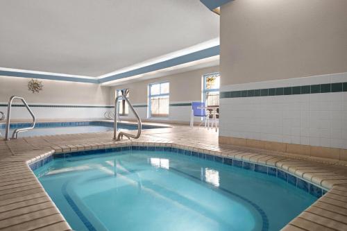 a pool in the middle of a hotel room at Days Inn & Suites by Wyndham Airport Albuquerque in Albuquerque