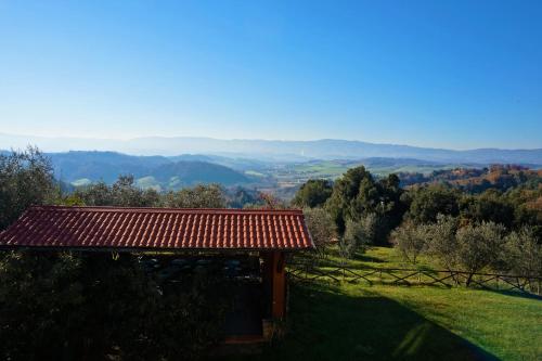 a gazebo with a view of a valley at Agriturismo Antico Borgo Poggitazzi in Loro Ciuffenna