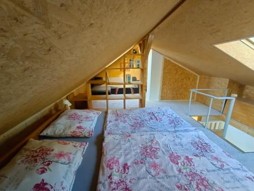 a bedroom with two beds and a bunk bed at Doudleby u Českých Budějovic in Doudleby