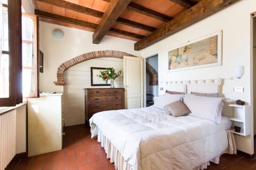 En eller flere senge i et værelse på La Locanda Di Filo