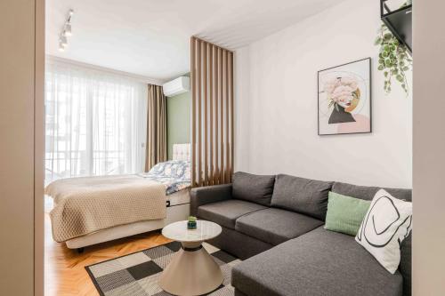 a living room with a couch and a bed at Stella Andrea Luxury Apartment in Bar