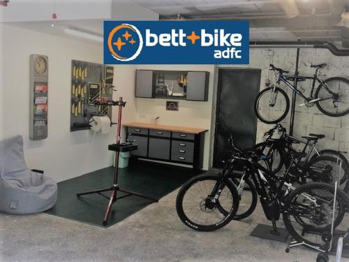 a bike shop with two bikes parked in a garage at Nonas B&B in Galtür