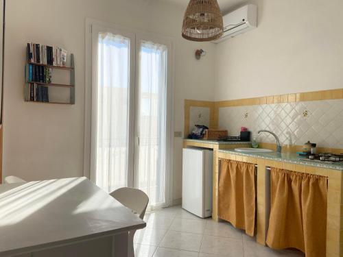 a kitchen with a sink and a dishwasher at Rosa Dei Venti Marettimo in Marettimo