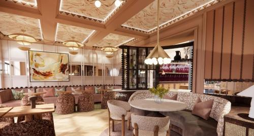 a restaurant with tables and chairs in a room at Villa Nord in Trondheim