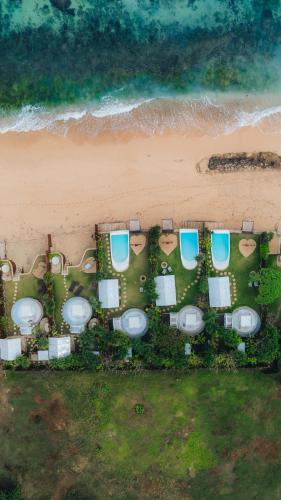 an overhead view of a group of toilets on the beach at Bubble 1 - Romantic Private Pool Love Dome Uluwatu in Uluwatu