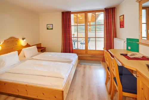 Tempat tidur dalam kamar di Ferienanlage Reithof