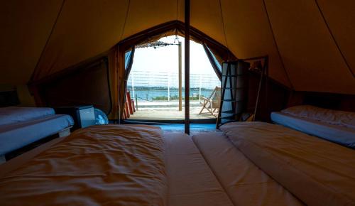 Romantic Glamping Retreat with Shaded Terrace & Sun Loungers in Faro District, Portugal