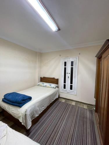 a bedroom with two beds and a window at Private Bella Rum Villa with Garden in Marsa Matruh