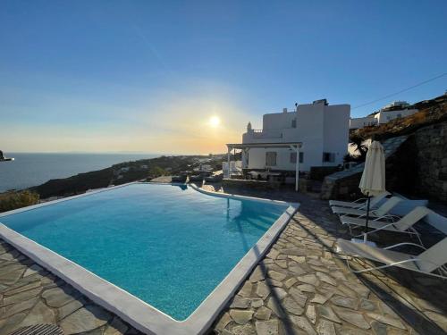 a swimming pool with a view of the ocean at Luxury Villa Dorothea Mykonos in Fanari