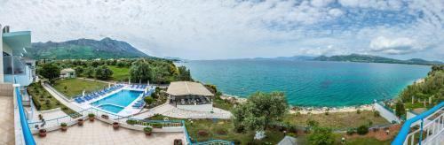 an aerial view of a resort with a pool and a lake at Cliff Bay Hotel by GHH in Paleros