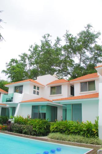 a building with a pool in front of it at Villas Maria Isabel in Santa Cruz Huatulco