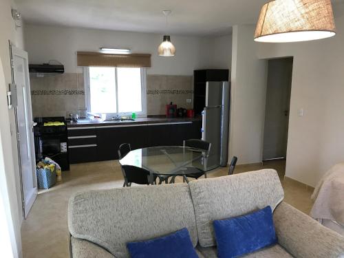 a living room with a couch and a glass table at Casonas de Nono in Nono