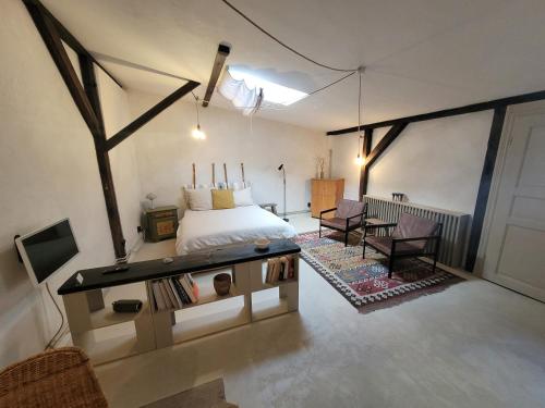 a bedroom with a bed and a table and chairs at Kranich in Ueckermünde