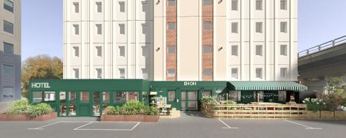 a building with a parking lot in front of it at Hôtel EH OH Orly Rungis in Rungis