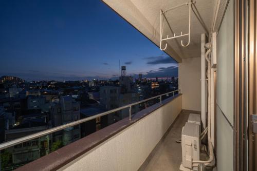 a balcony with a view of a city at AS Residence Komagome in Tokyo