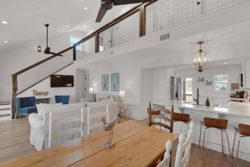 a dining room and living room with a table and chairs at Spacious 3BR Beach Retreat Sleeps 10 Family Ready in Port Saint Joe