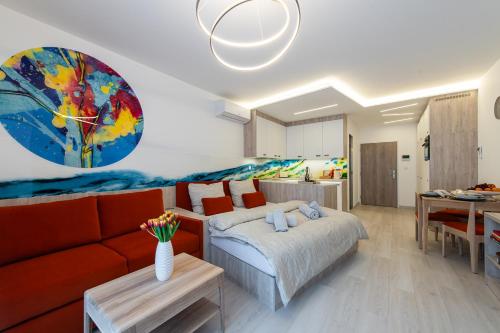 a living room with a bed and a couch at PREMIUM Apartments Old Town in Košice