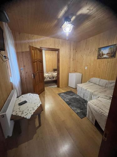 a room with two beds and a table in it at Санаторий "Синяк" гостиный двор "ПРОЛИСОК" in Sinyak