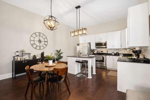 a kitchen and dining room with a table and chairs at Derby & Bourbon Trail Homebase W Private Backyard in Louisville