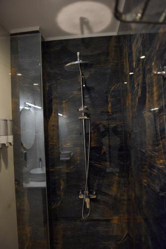 a bathroom with a shower with a glass door at The ViewPoint VP3 in Mytilene