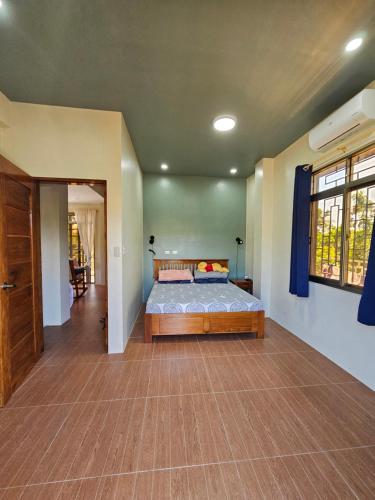 a bedroom with a bed in a room at Island Nest in Virac