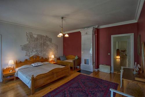 a bedroom with a bed and a map on the wall at Lantlivlodge i Österjörn -Herrgård in Österjörn