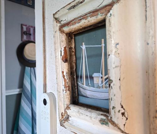 a picture of a boat in a window at Reebok Rest in Reebok