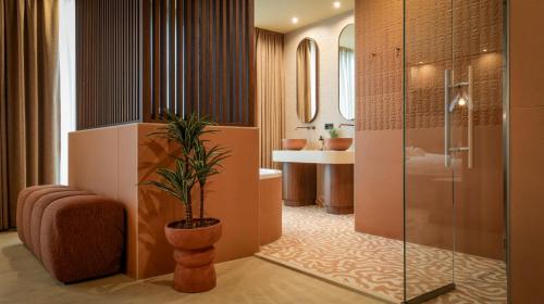 a bathroom with a shower and a toilet and a sink at Van der Valk hotel Veenendaal in Veenendaal