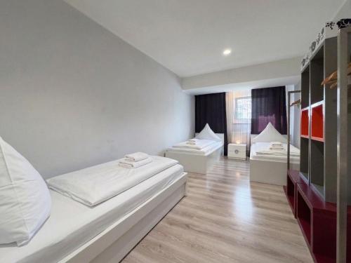 a room with two beds and a window at City-Apartment Spreeufer im Herzen Berlins in Berlin