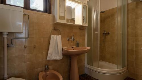 a bathroom with a sink and a shower and a toilet at House Katarina by Villas Guide in Blato