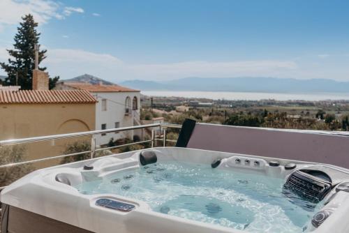 a hot tub on the balcony of a house at WELCS CASA 335 EMP con jacuzzi y terraza in Selva de Mar
