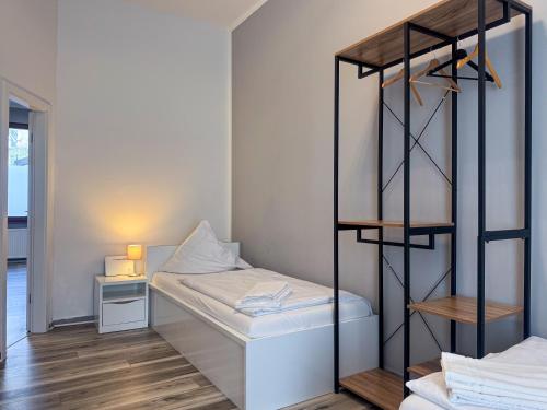 a small room with a bunk bed and a desk at City-Apartment Timeless in Berlin