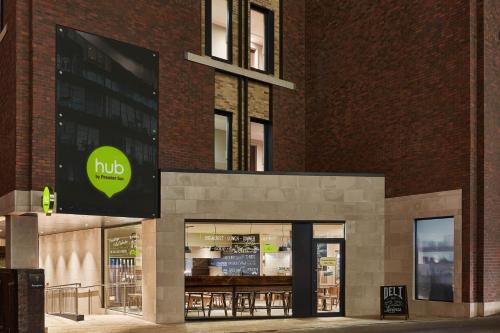 a store front of a brick building at hub London - Tower Bridge in London