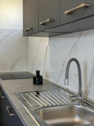 a kitchen counter with a sink and a sink at Adrijana 2 in Krk