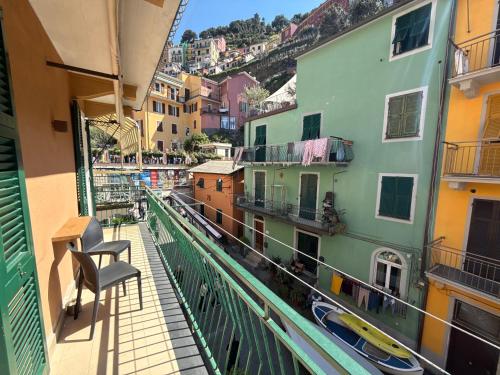 a balcony with a view of a city with buildings at Mare Calmo 2 in Manarola