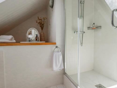 a bathroom with a shower and a sink at Poldue House in Camelford