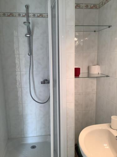 a bathroom with a shower and a sink at Penty in Crozon