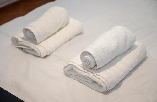 two towels sitting on top of a white counter at KAMVISSIS HOTEL in Tyros