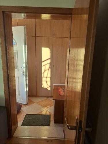 a door leading into a room with a hallway at Apartman Mirjana in Mlini