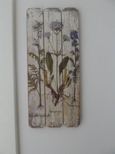 a painting of flowers on a wall at Savski Gaj in Zagreb