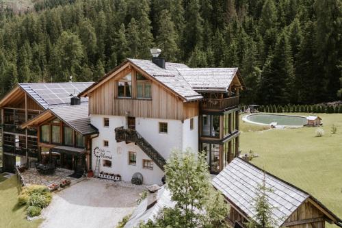 an aerial view of a house in the mountains at Chalet Mornà in San Martino in Badia