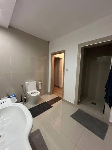 a bathroom with a sink and a toilet in it at AURA House in Krępa