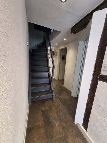a hallway with a staircase in a house at Der kleine Eifel-Ritter in Manderscheid