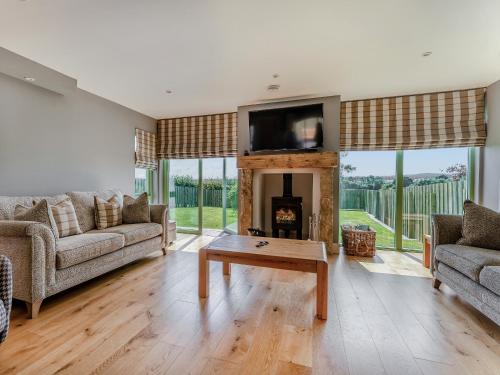 a living room with a couch and a table at Mayflower - Uk43632 in Grange
