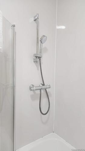 a shower with a shower head on a wall at 12A-2 Stobhill Road in Arniston