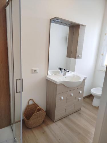 a bathroom with a sink and a mirror at Light Loft Marsciano in Marsciano