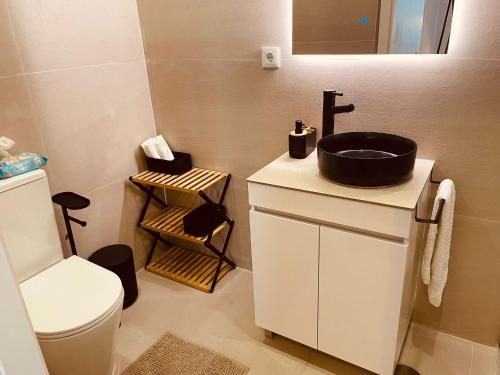 a bathroom with a sink and a toilet at Casa da Avo Ilda - Near the Sea in Matosinhos